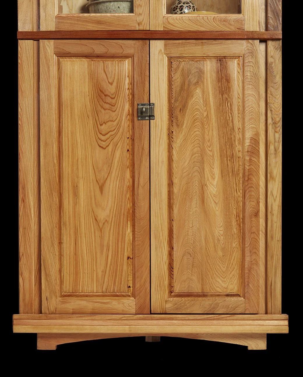 Cypress corner cabinet with decorative pattern and latch