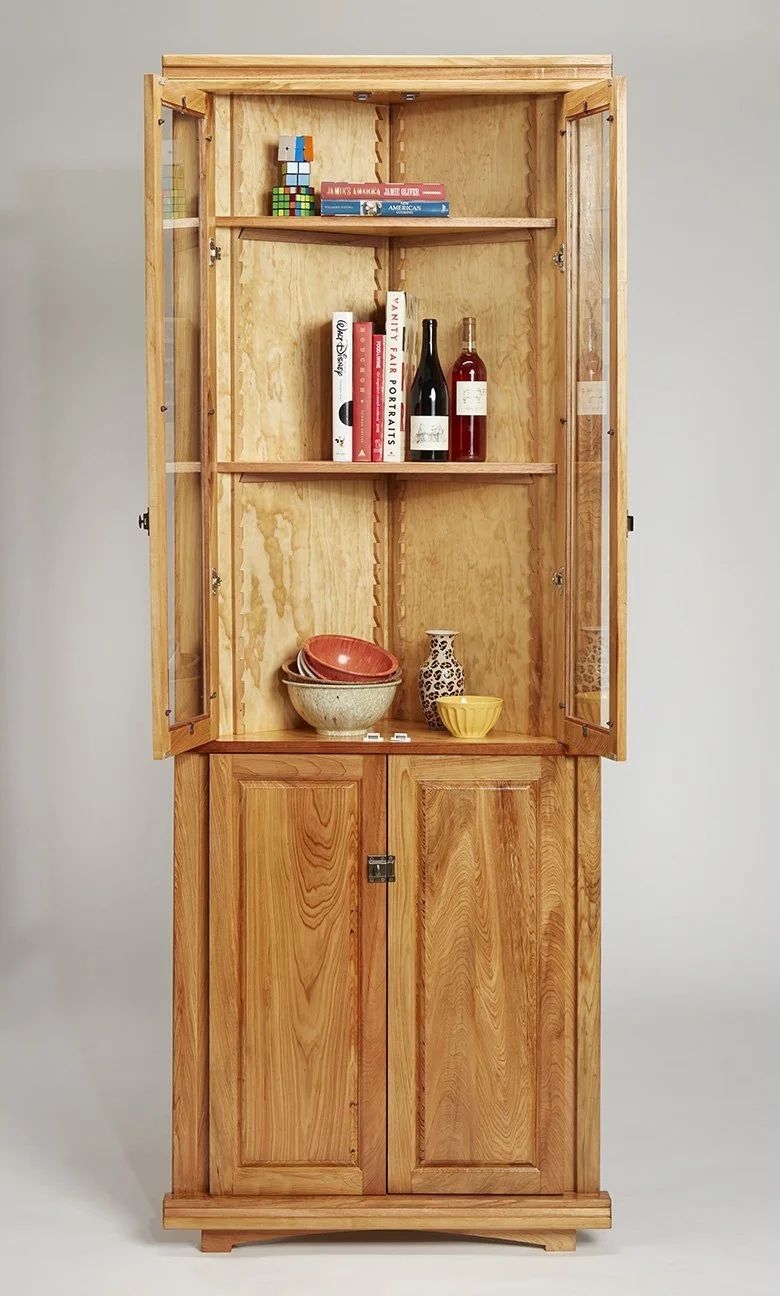 Cypress corner cabinet with glass doors open